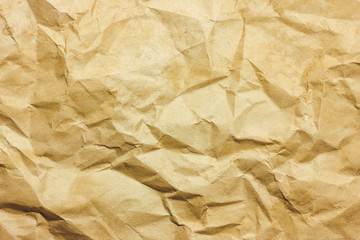 Stained and crumpled retro brown paper background.