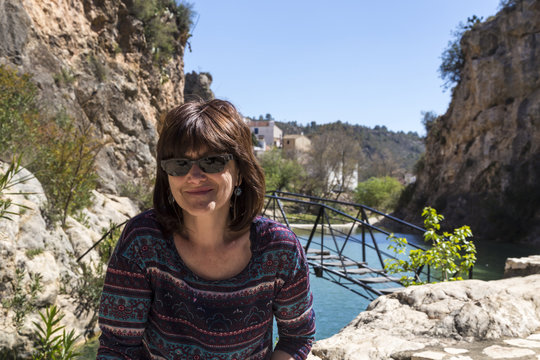woman with sunglasses on a lake