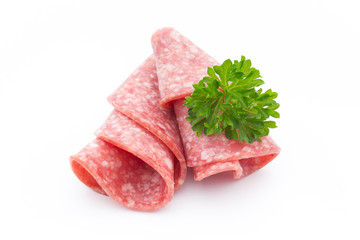 Salami sausage slices isolated on white background.