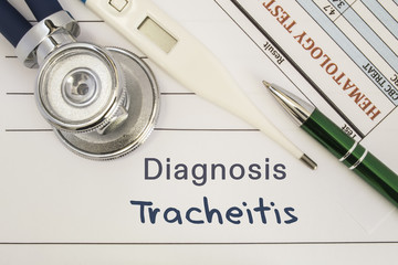 Diagnosis of Tracheitis. Stethoscope, electronic thermometer, common blood test results are on medical form, which indicated diagnosis of Tracheitis. Concept for internal medicine physician