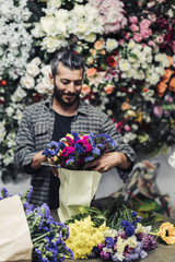 male florist working in flower shop