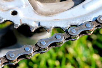 Polluted bicycle chain and part of a bicycle gear