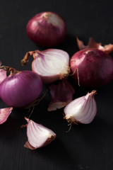 shallots still life black background