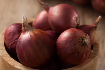 shallots still life wood background close up