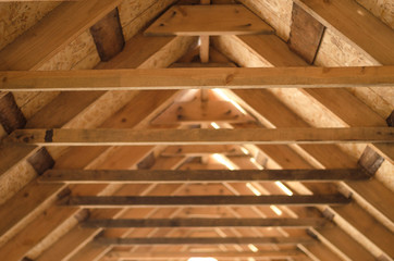 Interior view of a wooden roof structure.
