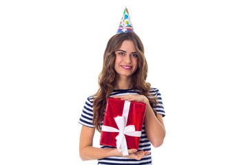 Woman in celebration cap holding a present 