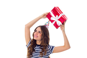 Woman in celebration cap holding a present 