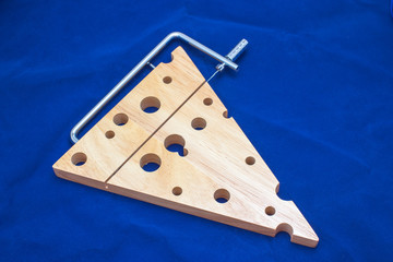 Wooden chopping board with cheese cutter