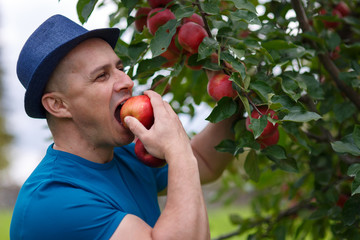 Gardener eating an apple