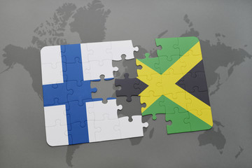 puzzle with the national flag of finland and jamaica on a world map background.