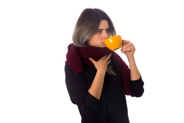 Woman drinking from yellow cup