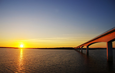 Fototapeta na wymiar sunset in alqueva lake and bridge