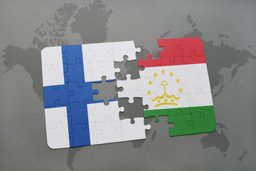 puzzle with the national flag of finland and tajikistan on a world map background.