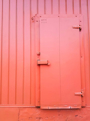 orange color door on orange color wall