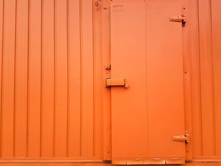 orange color door on orange color wall