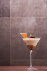 tiramisu in glass cup with dark background