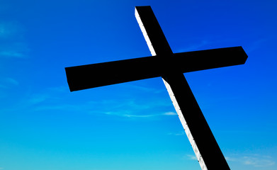Christian cross over beautiful sunny sky