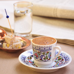 Concept of turkish coffee. Turkish delight on authentic plate