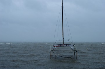 Fototapeta premium Boat on the Stormy Bay