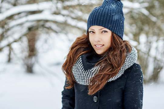 Beautiful pretty young woman in winter