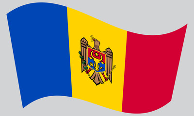 Flag of Moldova waving on gray background