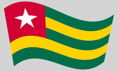 Flag of Togo waving on gray background