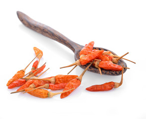 dried chilli on wooden spoon isolated on white background.