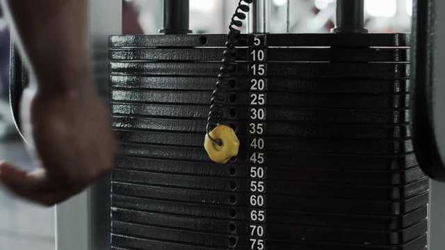 Male hand increase weight of stack plates