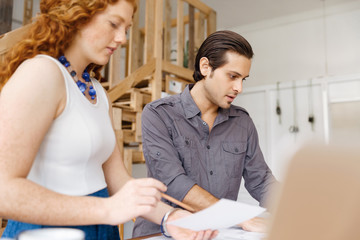 Fototapeta premium Two young architects in office