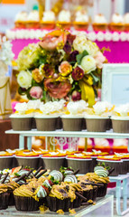 Sweet wedding cupcakes./ Sweet beauty flower and topping pastel color on wedding cake decoration.
