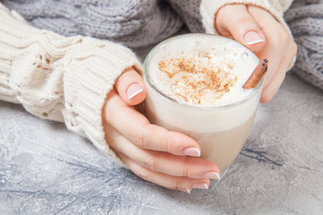 woman hands with a latte