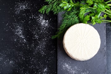 cheese on a dark wooden surface