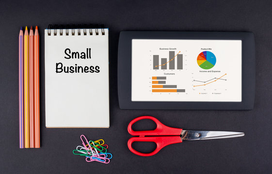 Small Business. Tablet, pencils, scissors, paper clips and note