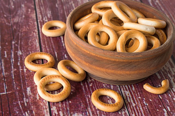 Drying in a wooden bowl.   Small drying in a wooden bowl on old wooden table.