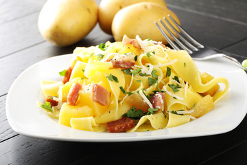 Pasta with ham and potatoes - 124091356