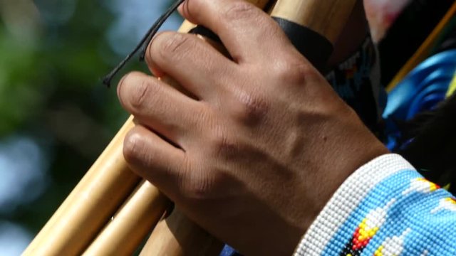 Native American artist playing flute