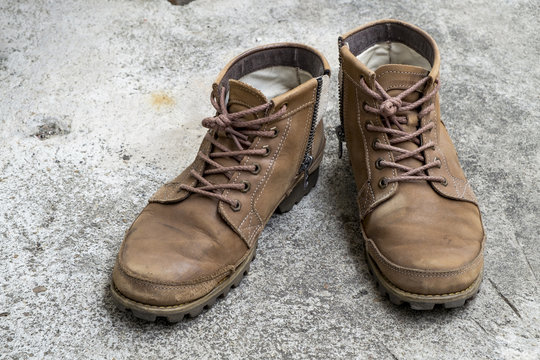 Men leather shoes on a concrete floor