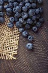 ripe sweet blueberries on wooden table