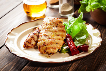 Grilled chicken breasts served with grilled paprika