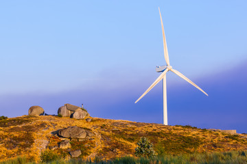 Windmill power generator and famous stone house - Guimaraes Port
