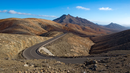 mountain road, winding between the red coloured mountains