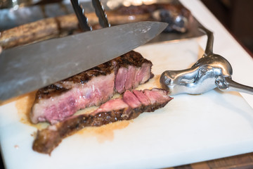 Barbecue Wagyu Tomahawk Steak on old Cutting Board
