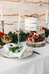 A homelike romantic composition with a cake, nuts and red fruit