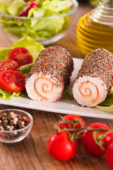 Goat cheese with salad and cherry tomatoes. 