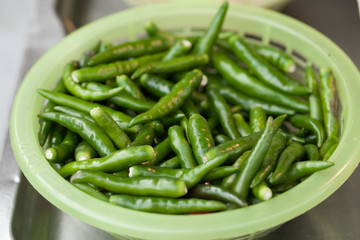 Green pepper in plastic basket