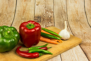 Healthy vegetables on wooden background