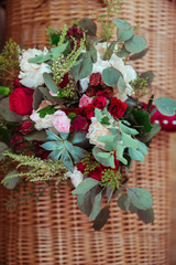 Tiny red and pink flowers put in gorgeous autumn bouquet