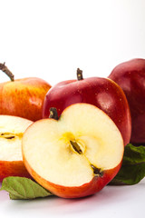 whole apples and half on a white background