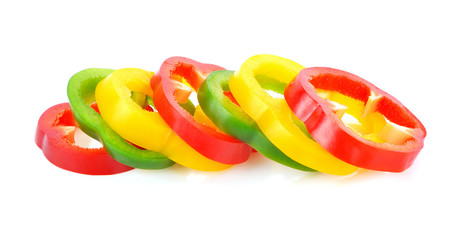 Sliced red yellow green pepper isolated on white