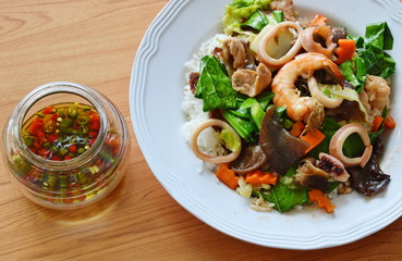 stir fried mixed vegetable with seafood and chili fish sauce